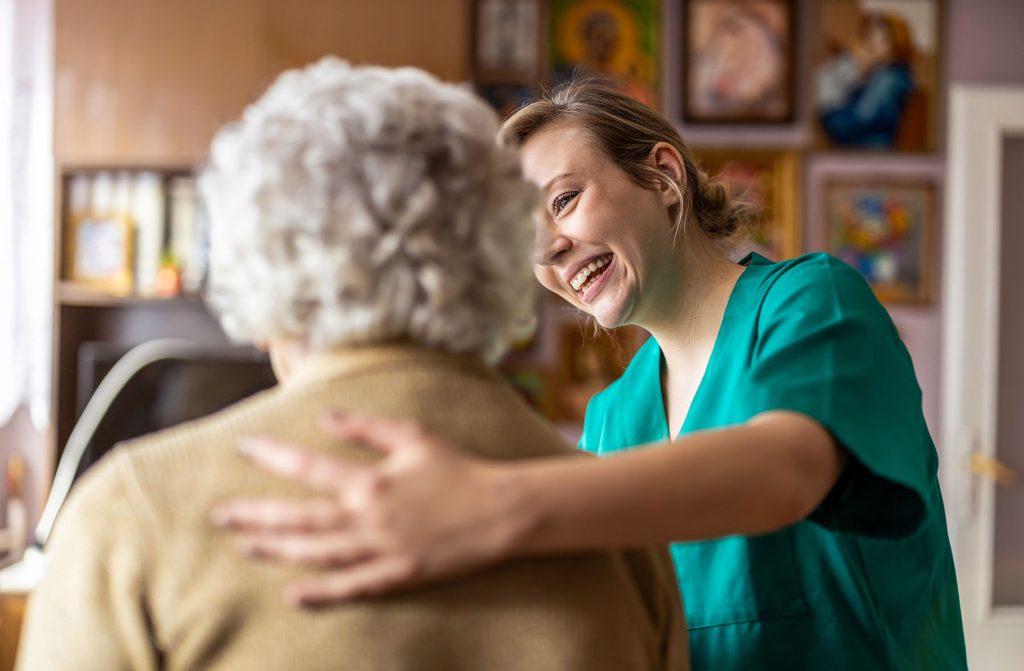 Nurse talking to elderly woman